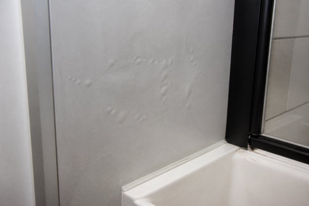 Why Do Bathroom Wall Panels Bubble? Causes and Fixes